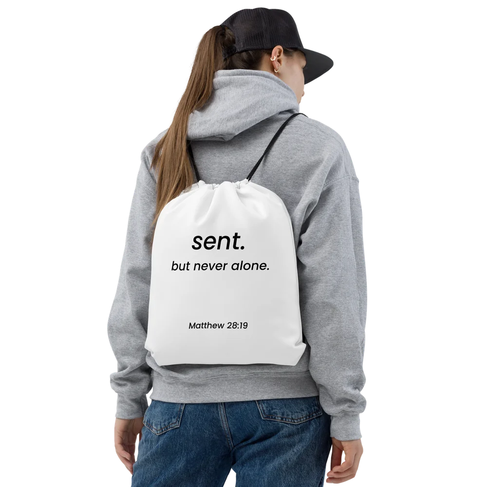 Model wearing the Sent drawstring bag as a backpack